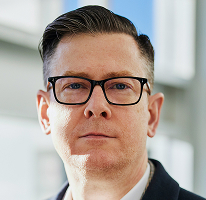 Imagen de Alexander Hughes, director ejecutivo de compañía dedicada al comercio de criptoactivos